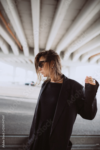 Fashion street portrait of a modern emotional woman