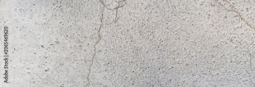 Foto Weathered concrete texture with cracks, industrial gray cement wall background,