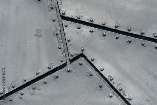 Iron sheets with rivets. Sheet steel armor. Background.