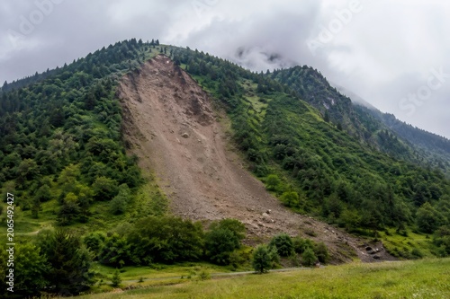 Mountain slope showing recent landslide and erosion damage