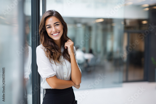 Young happy attractive corporate manager, elegant skirt, business transformation workshop, motivated workforce, leadership success