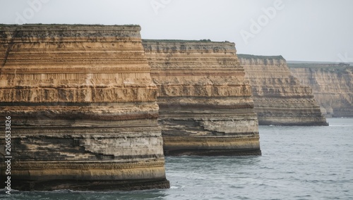 Oceanfront cliffs revealing multiple sedimentary layers of limestone sandstone siltstone and mudstone