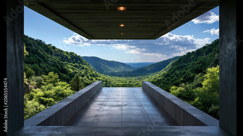 View from a modern structure overlooking a green valley and blue sky in daylight