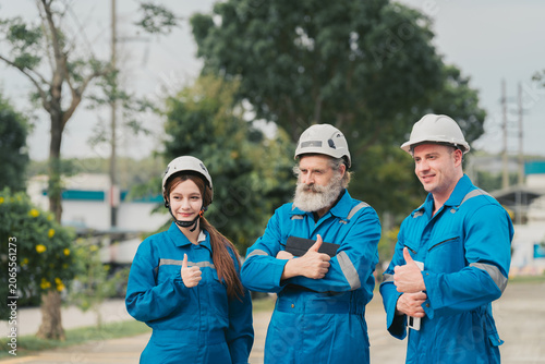 Photography Industrial worker safety helmet blue coverall outdoor teamwork thumbs up constru