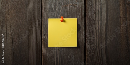 Yellow sticky note pinned t...