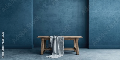 Wooden table with gray fabr...