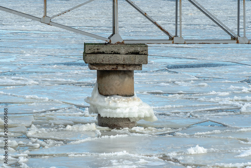 protective rocks of the breakwater covered with ice
