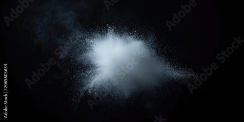 White powder explosion against a black background