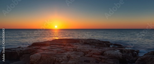Sunset over the ocean with ...