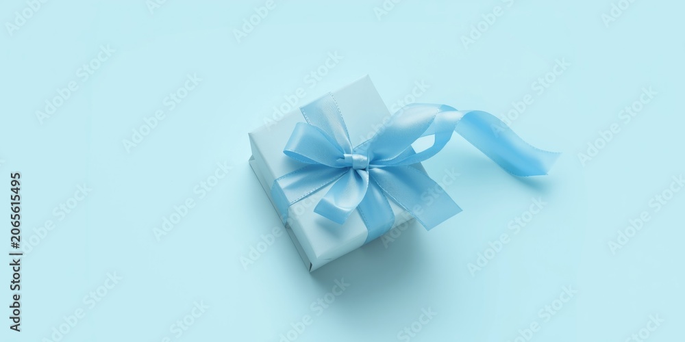 Obraz premium Simple sky blue gift box captured over a solid white background