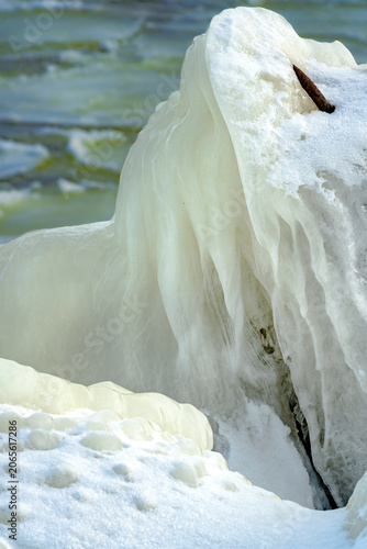 protective rocks of the breakwater covered with ice