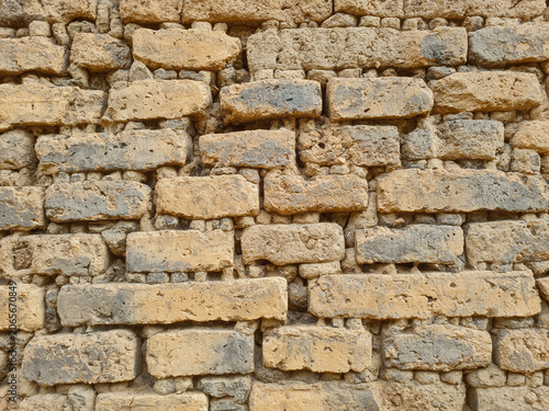Ancient walls made of bricks glued together with clay