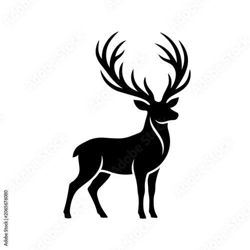 Bild auf Leinwand Stately deer silhouette with large branched antlers standing in profile