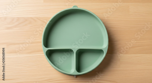 Mint green segmented bowl with handle for food storage or organization mockup, blank spaces for text