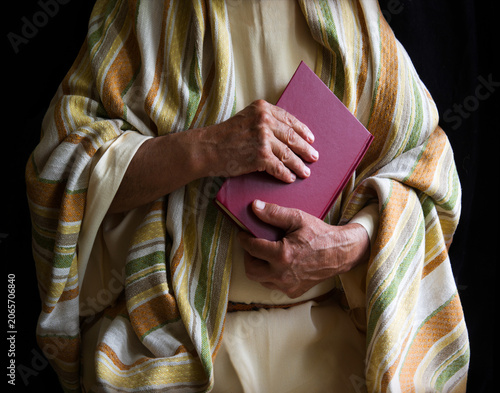 Old man holding a book