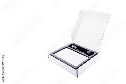 Fotografie open white box with a diode illuminator and cable inside