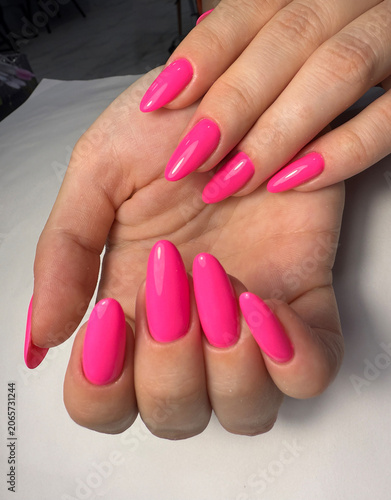 Bright Neon Pink Almond Nails Manicure Close Up