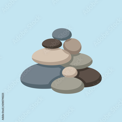 Canvas Print A stack of smooth river stones rests on a light background