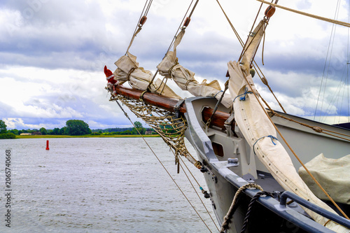 Photography Bow of a traditional sailing ship with rigging and bowsprit net in Arnis on the
