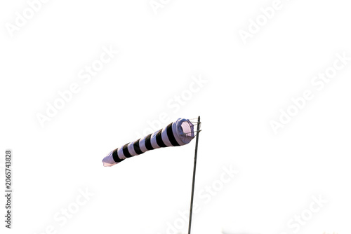 Black and white striped windsock used to indicate wind direction and speed.