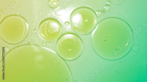Close-Up of Colorful Liquid Droplets on Smooth Surface