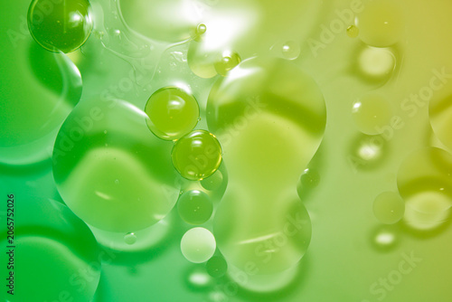 Abstract Green and Yellow Liquid Background with Bubbles in Water