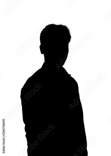 Fotografie Silhouette of a young man standing against a white background