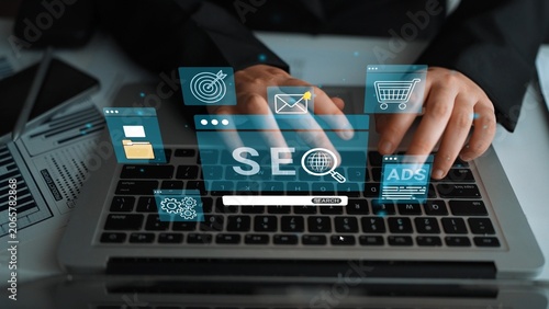 фотографія A close-up of hands typing on a laptop surrounded by SEO and digital marketing icons, showcasing the integration of technology and business strategy in a modern workspace
