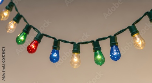 Colorful string lights with illuminated bulbs in festive colors