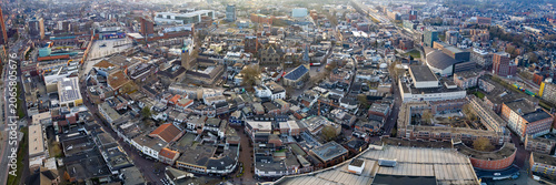 Aerial view beside the old town above the city Enschede in the netherlands, on a sunny afternoon in autumn.