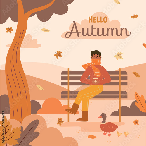 Man sitting on a bench in autumn.