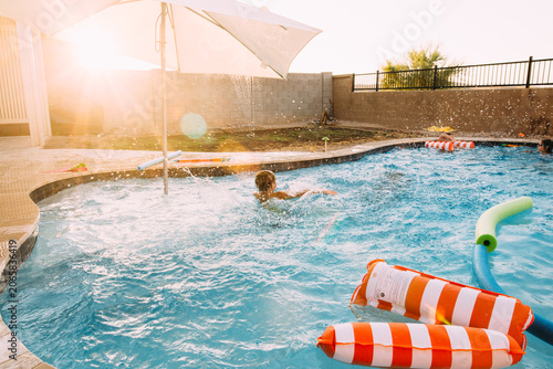 Boy swimming in pool