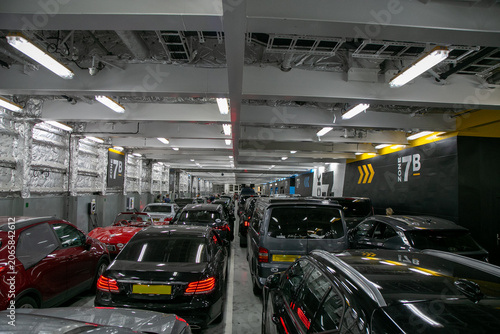 Fotografie Crowded interior vehicle deck of a commercial car ferry operating on a cross-Channel route such as Dover to Calais