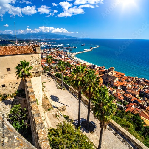 Aerial view of coastal town with clear blue water.