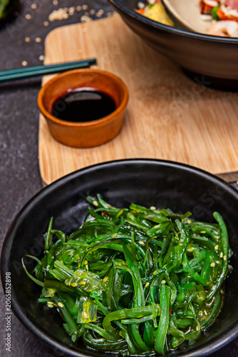 Obraz na plátně Wakame seaweed prepared as a salad, showing its characteristic moist appearance after rehydration and dressing