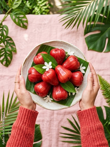 Fresh Rose Apples on Tropical Leaf Plate