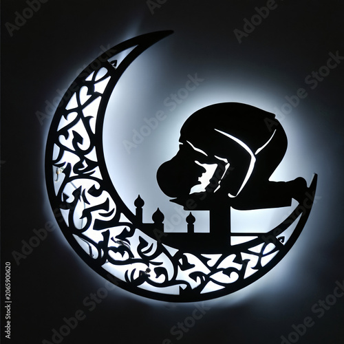 Praying Silhouette on Crescent Moon at Night