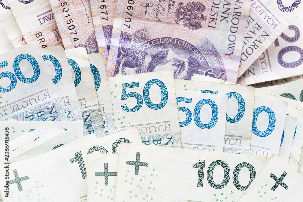 Fototapeta premium Polish banknotes arranged as financial background. Cash money concept for savings budgeting and personal finance. Currency used for payments investment and everyday expenses.