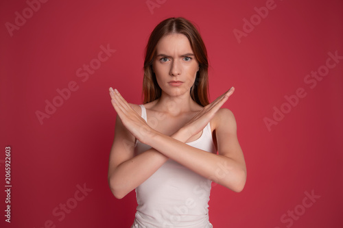 Serious woman showing stop gesture