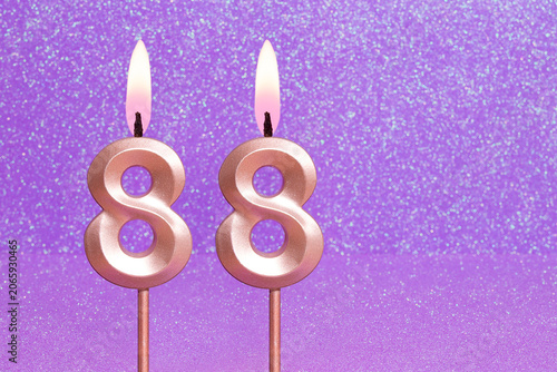 Number 88 on a pink background with blurred bright dots - Birthday or anniversary card with abstract blurred dots that glow