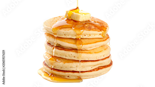 Tableau sur toile Stack of sweet homemade pancakes topped with butter and pouring honey isolated o