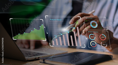Tableau sur toile Business professional analyzing futuristic digital graphs and revenue metrics on