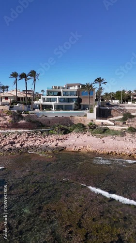 Cabo Roig Spain coastal villas and rocky shoreline aerial view