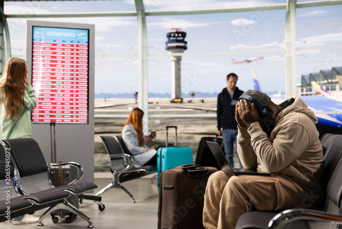 Cuadro en lienzo Digital nomad professional waiting for delayed flight in airport lounge, receiving bad news about plane departure, Traveler conveys flexible job, online productivity during nomadic lifestyle