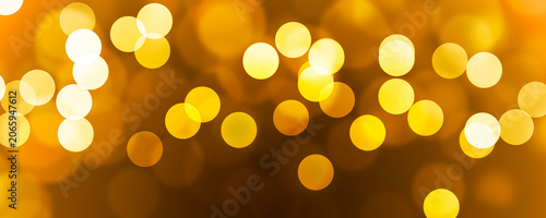 Golden Bokeh Lights Background with Warm Glowing Defocused Circles
