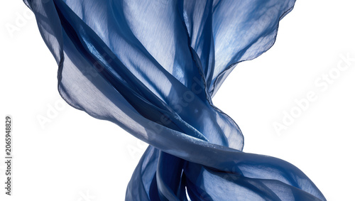 Valokuva Isolated flowing rich blue silk fabric with elegant folds and sheer texture in g