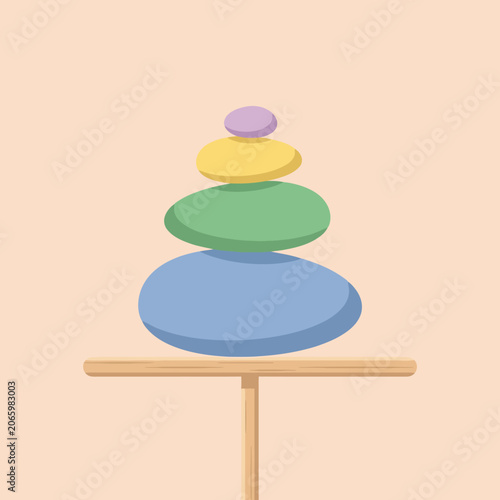 A stack of colorful smooth stones rests on a wooden base