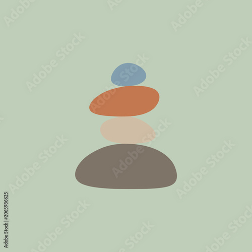 Canvas Print A stack of smooth colorful stones on a soft green background