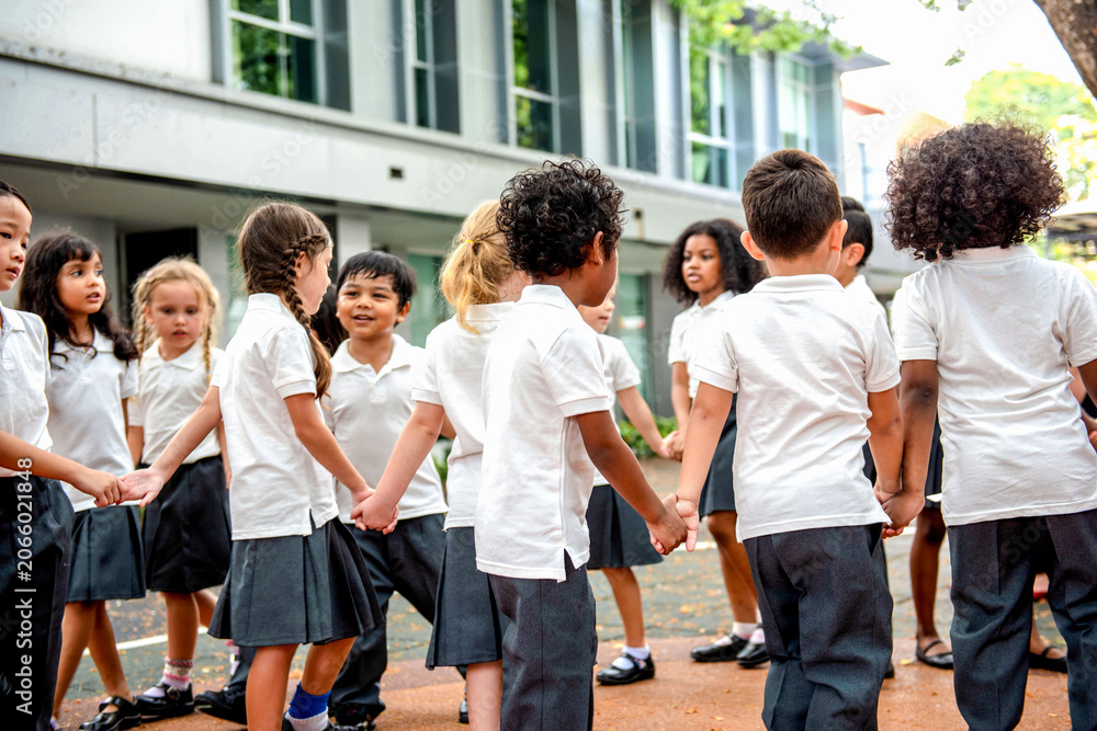 Fototapeta premium Children playing outdoors in school