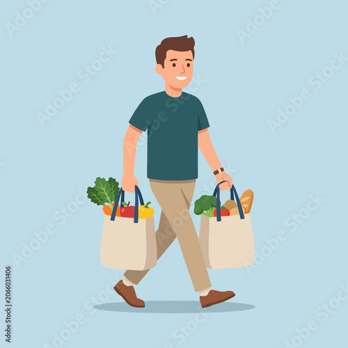 Valokuva A young man carries two bags filled with fresh healthy groceries